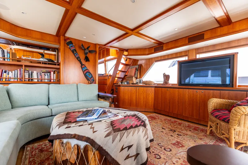Slide: The Image of Luxurious interior of 2005 West Bay 86 Raised Pilothouse Motor Yacht with elegant wood finishes. - 17