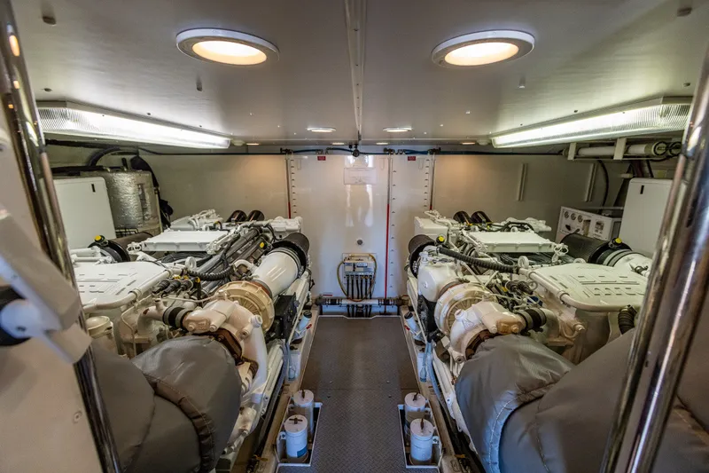 Slide: The Image of Engine room of 2005 West Bay 86 Raised Pilothouse Motor Yacht, showcasing dual engines. - 116