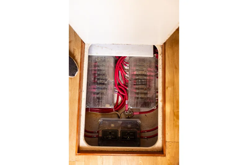 Slide: The Image of Electrical panel with red wiring in 2005 West Bay 86 Raised Pilothouse Motor Yacht. - 144