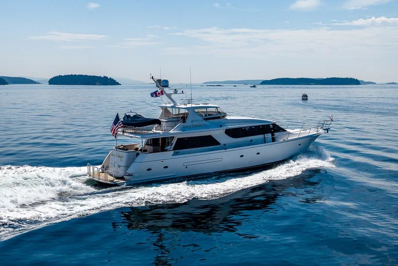 Slide: The Image of 2005 West Bay 86 Raised Pilothouse Motor Yacht cruising on open water. - 157