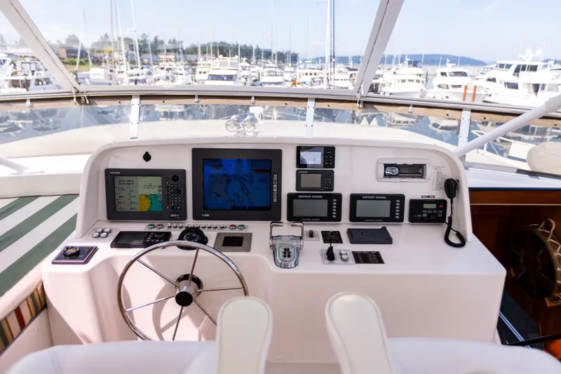 Slide: The Image of Helm of 2005 West Bay 86 Raised Pilothouse Motor Yacht with navigation equipment. - 100