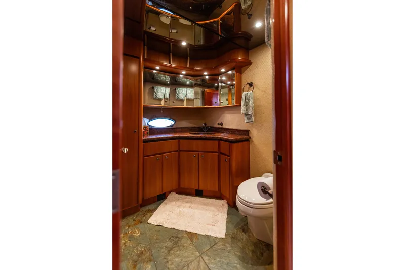 Slide: The Image of Luxurious bathroom in 2005 West Bay 86 Raised Pilothouse Motor Yacht with elegant wood cabinetry. - 73
