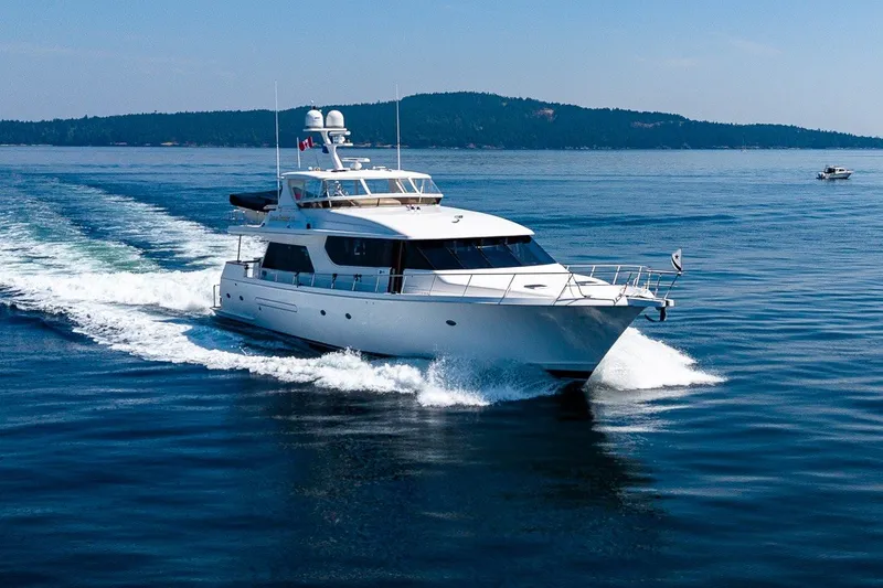 Slide: The Image of 2005 West Bay 86 Raised Pilothouse Motor Yacht cruising on open water. - 155