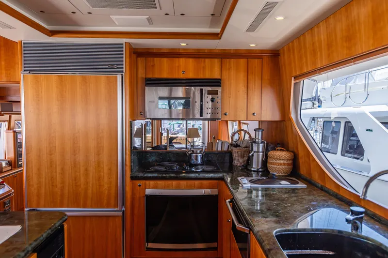 Slide: The Image of Luxurious kitchen interior of 2005 West Bay 86 Raised Pilothouse Motor Yacht. - 24