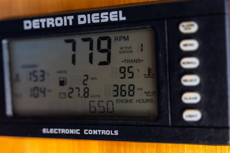Slide: The Image of Detroit Diesel electronic control panel on 2005 West Bay 86 Motor Yacht, displaying engine metrics. - 47