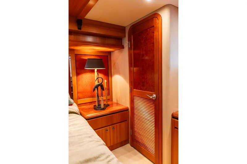Slide: The Image of Luxurious wooden interior of 2005 West Bay 86 Raised Pilothouse Motor Yacht cabin. - 69