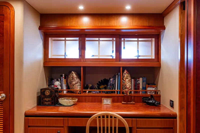 Slide: The Image of Luxurious wooden desk area on 2005 West Bay 86 Raised Pilothouse Motor Yacht. - 64