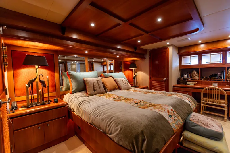 Slide: The Image of Luxurious bedroom in 2005 West Bay 86 Raised Pilothouse Motor Yacht, featuring elegant wood finishes. - 58
