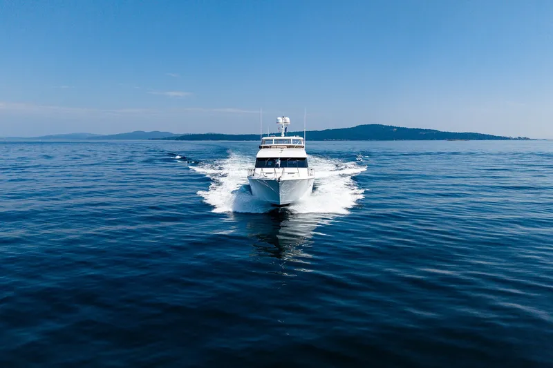 Slide: The Image of 2005 West Bay 86 Raised Pilothouse Motor Yacht cruising on open water. - 151