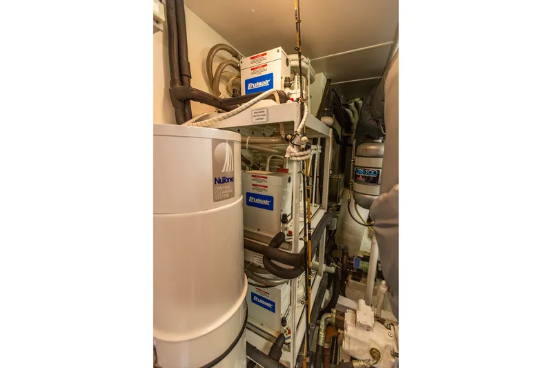 Slide: The Image of Engine room of 2005 West Bay 86 Raised Pilothouse Motor Yacht with NuTone central cleaning system. - 126