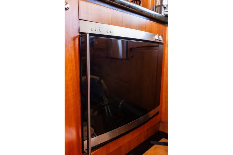 Slide: The Image of Built-in dishwasher in 2005 West Bay 86 Raised Pilothouse Motor Yacht kitchen. - 30
