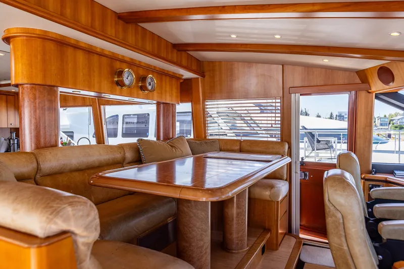 Slide: The Image of Luxurious interior of 2005 West Bay 86 Raised Pilothouse Motor Yacht with elegant wood finishes. - 35