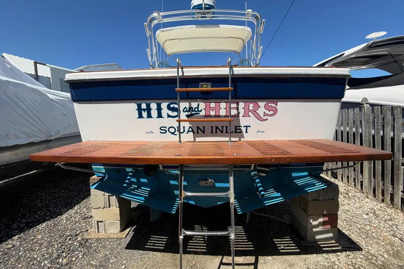 The Image of 1985 Formula 31 Performance Cruiser docked, featuring "His and Hers" and "Squan Inlet" text. - 0