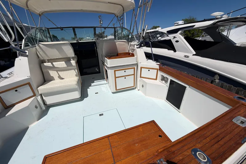 Slide: The Image of 1985 Formula 31 Performance Cruiser boat interior with seating and storage compartments. - 10