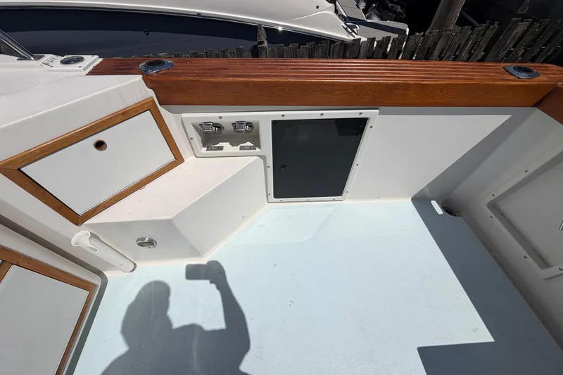 Slide: The Image of 1985 Formula 31 Performance Cruiser deck with wood accents and storage compartments. - 15