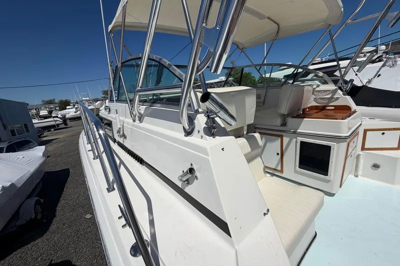 Slide: The Image of 1985 Formula 31 Performance Cruiser with white seating and stainless steel railings. - 20