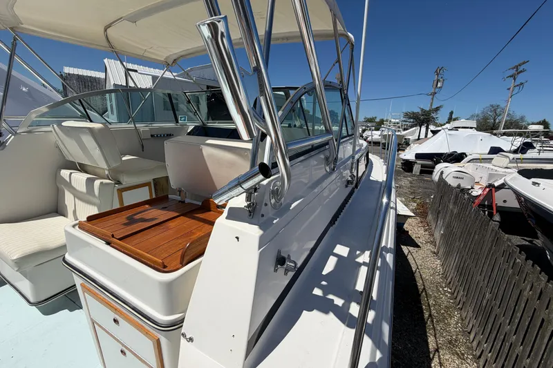 Slide: The Image of 1985 Formula 31 Performance Cruiser boat interior with seating and wooden accents. - 27
