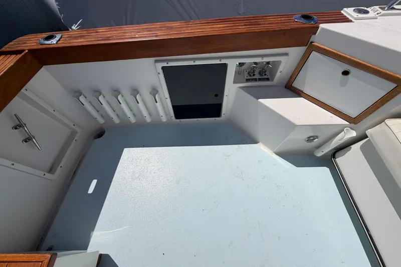 Slide: The Image of 1985 Formula 31 Performance Cruiser cockpit with wood trim and storage compartments. - 4