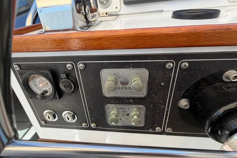 Slide: The Image of Control panel of a 1985 Formula 31 Performance Cruiser with docking lights and gauges. - 42