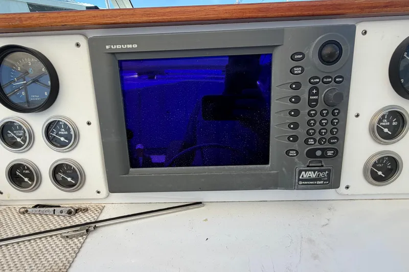 Slide: The Image of Control panel of a 1985 Formula 31 Performance Cruiser with Furuno navigation system. - 44