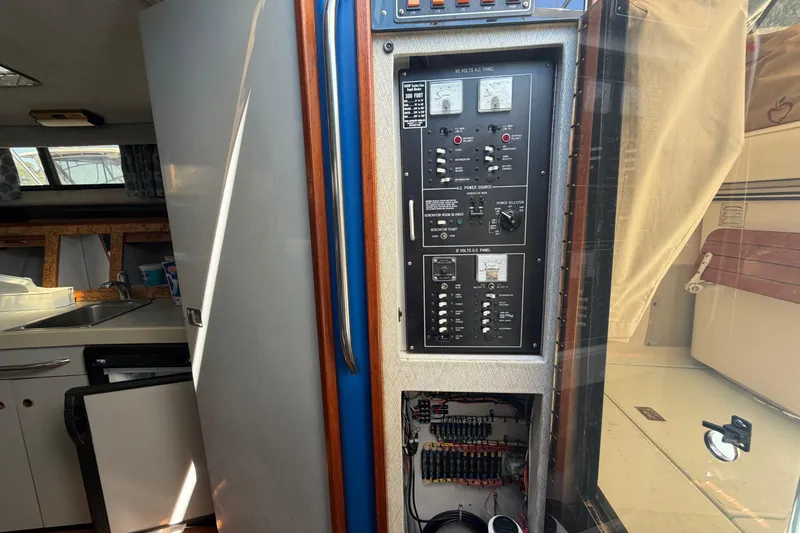 Slide: The Image of Interior of a 1985 Formula 31 Performance Cruiser showing control panel and kitchenette. - 55