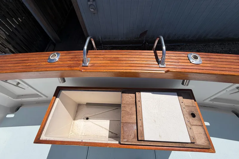 Slide: The Image of 1985 Formula 31 Performance Cruiser with wooden deck and storage compartment. - 6