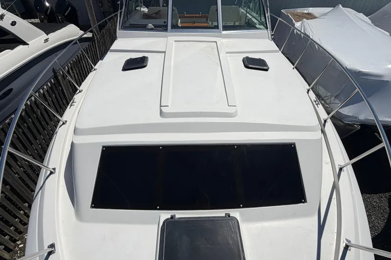 Slide: The Image of 1985 Formula 31 Performance Cruiser boat deck with railing and hatch. - 65