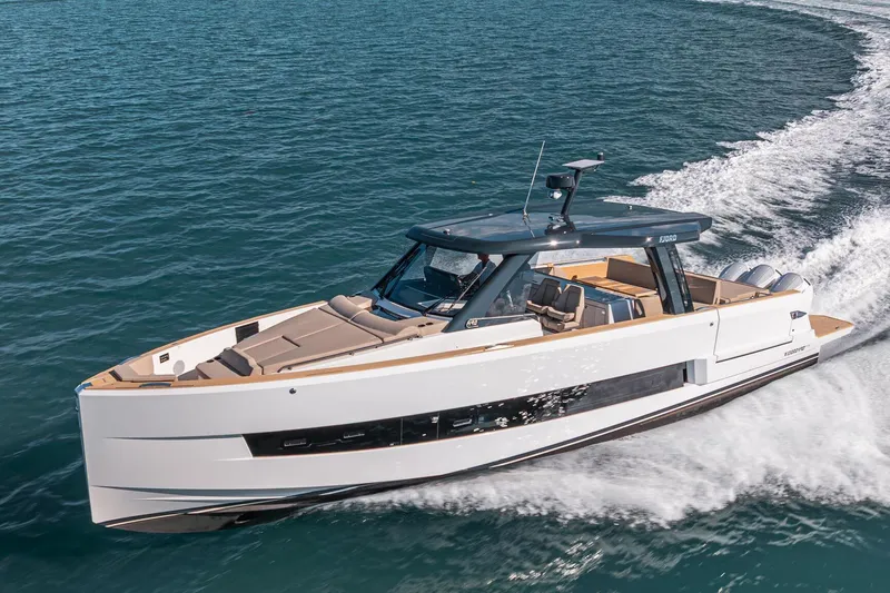 The Image of 2026 Fjord 490 SPORT yacht cruising on open water, showcasing sleek design and luxury. - 0