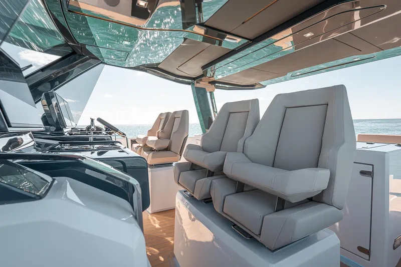 Slide: The Image of Luxurious interior of 2026 Fjord 490 SPORT yacht with modern seating and ocean view. - 11
