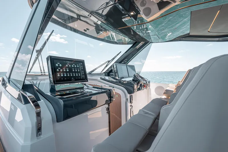 Slide: The Image of Interior view of 2026 Fjord 490 SPORT yacht cockpit with modern navigation systems. - 12