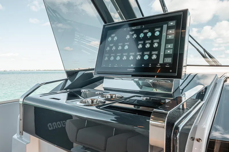 Slide: The Image of 2026 Fjord 490 SPORT yacht dashboard with advanced touchscreen navigation system. - 13