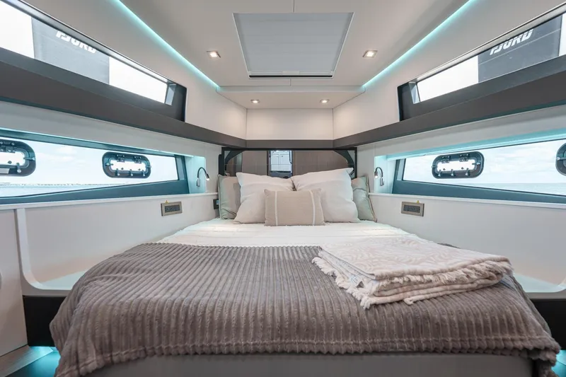Slide: The Image of Luxurious interior cabin of 2026 Fjord 490 SPORT yacht with cozy bedding. - 15