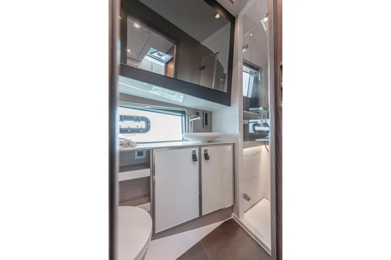 Slide: The Image of Modern bathroom interior of 2026 Fjord 490 SPORT yacht, featuring sleek design and fixtures. - 16