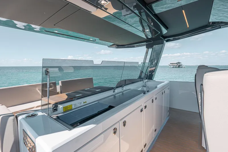 Slide: The Image of Luxurious interior of 2026 Fjord 490 SPORT yacht with ocean view. - 8