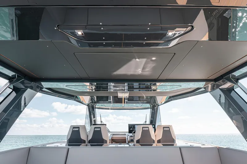 Slide: The Image of Interior view of 2026 Fjord 490 SPORT yacht, featuring sleek design and modern seating. - 9