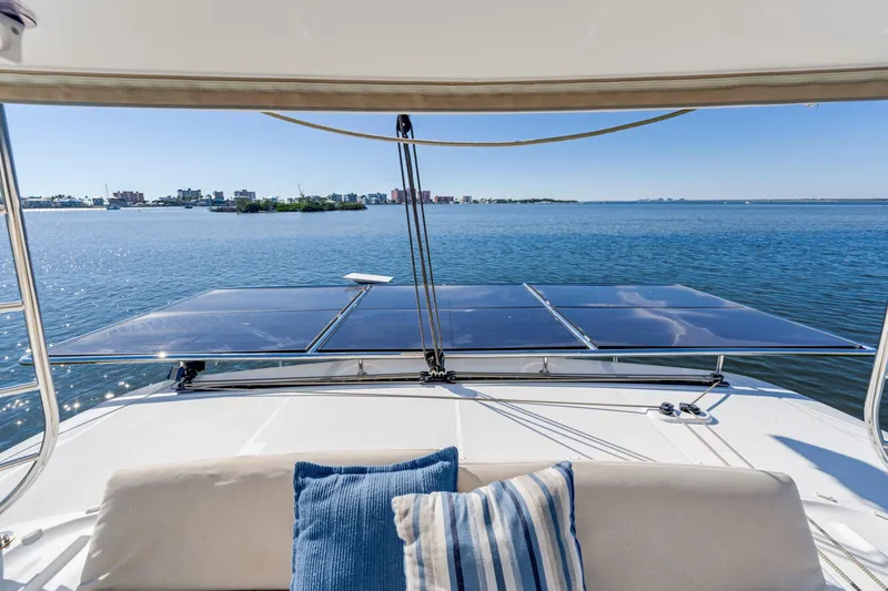 Slide: The Image of 2022 Lagoon 46 yacht with solar panels and scenic ocean view. - 10