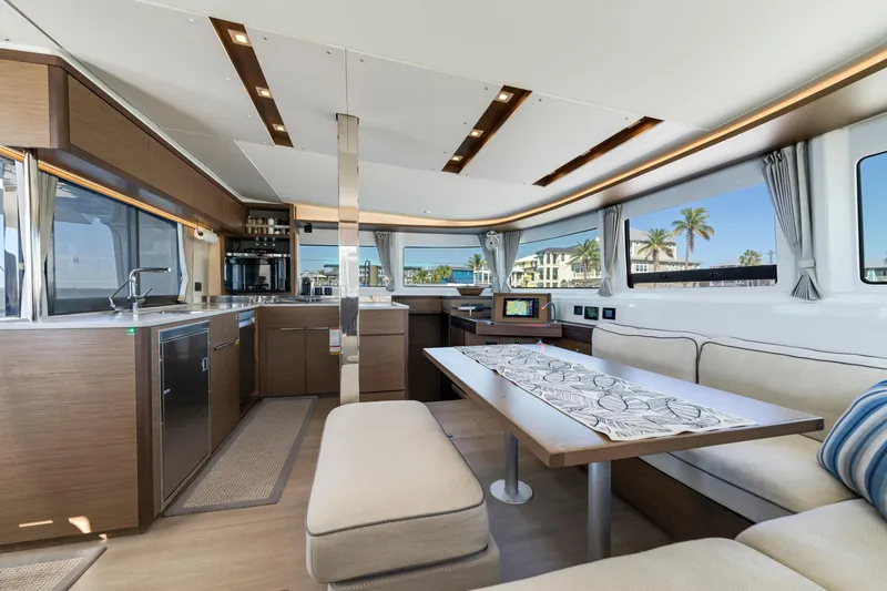 Slide: The Image of Luxurious interior of 2022 Lagoon 46 yacht with modern kitchen and seating area. - 15