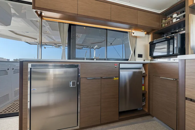 Slide: The Image of Modern kitchen interior on 2022 Lagoon 46 yacht with stainless steel appliances. - 18