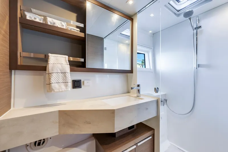 Slide: The Image of Modern bathroom interior on 2022 Lagoon 46 yacht with sleek fixtures and ample lighting. - 24