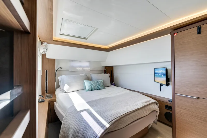 Slide: The Image of Luxurious cabin interior of 2022 Lagoon 46 yacht with cozy bed and modern amenities. - 29