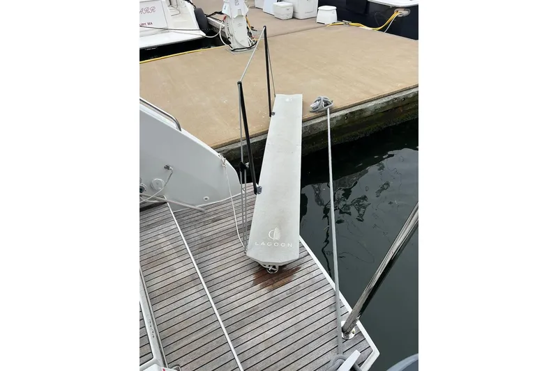 Slide: The Image of Lagoon 46 catamaran boarding platform, 2022 model, docked at marina. - 33