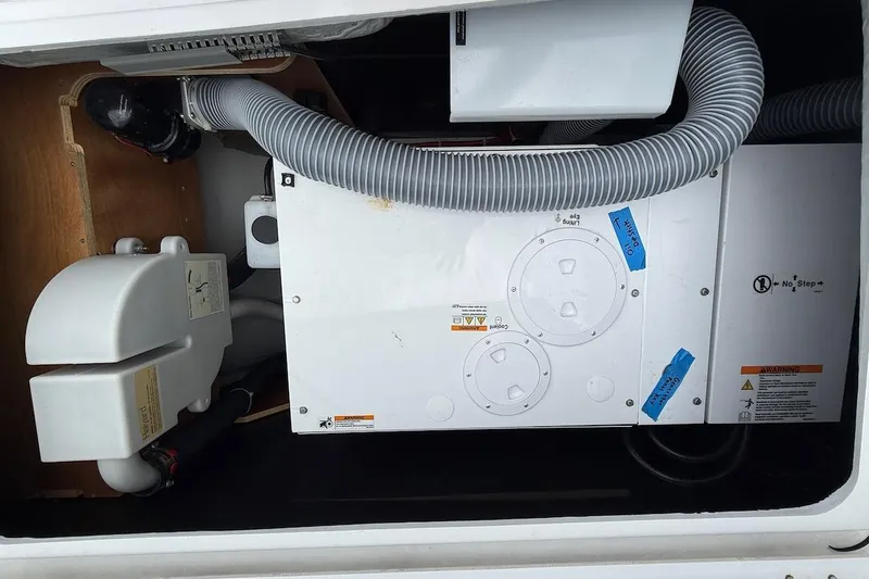 Slide: The Image of 2022 Lagoon 46 yacht engine compartment with ventilation hoses and equipment. - 34