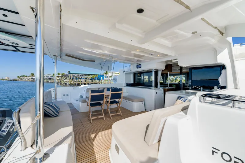 Slide: The Image of Luxurious 2022 Lagoon 46 yacht interior with spacious seating and ocean view. - 5