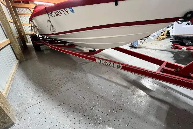 Slide: The Image of 1996 Donzi 22 Classic boat on red trailer in storage facility. - 5
