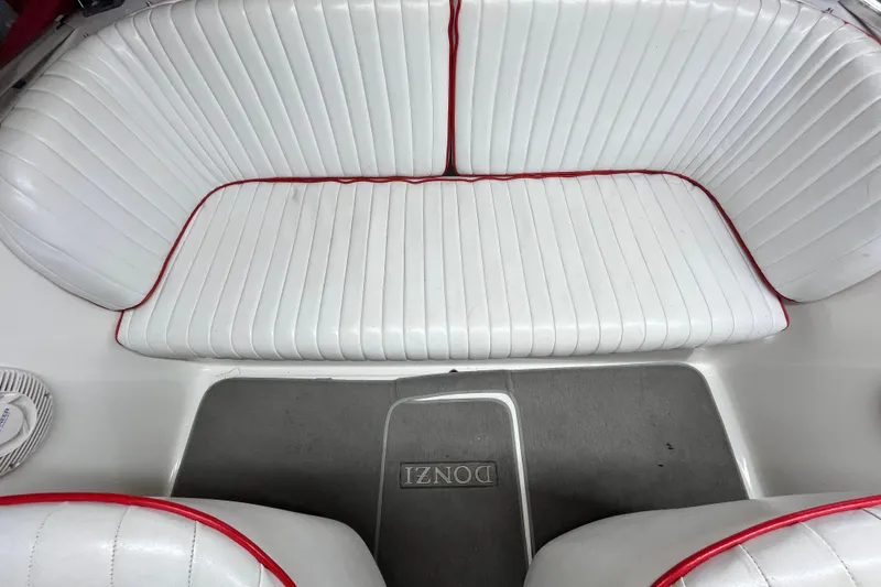 Slide: The Image of Interior of a 1996 Donzi 22 Classic boat with white and red seating. - 6
