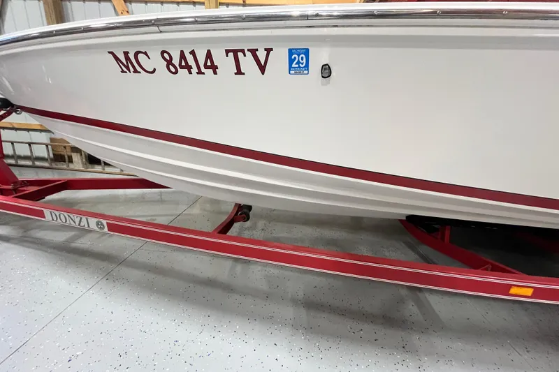 Slide: The Image of 1996 Donzi 22 Classic boat on red trailer, registration MC 8414 TV. - 7