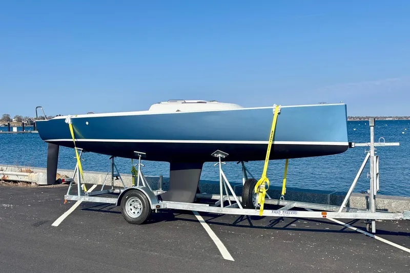 Slide: The Image of 2026 J Boats J/7 on trailer parked by the water. - 12