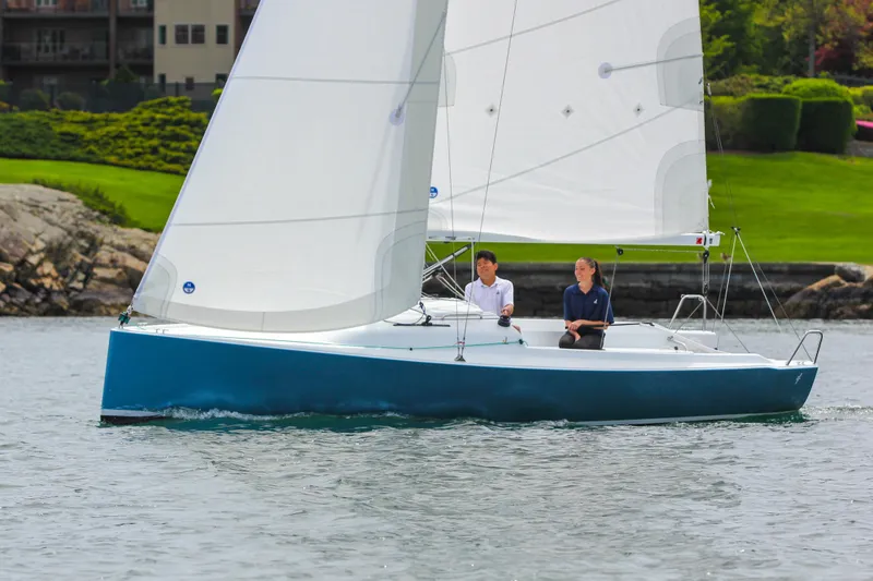 Slide: The Image of Sailboat J Boats J/7 2026 on calm water with two people. - 17