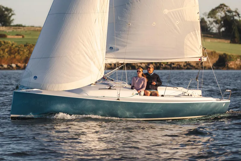 Slide: The Image of Sailboat J Boats J/7 2026 on calm water at sunset. - 6