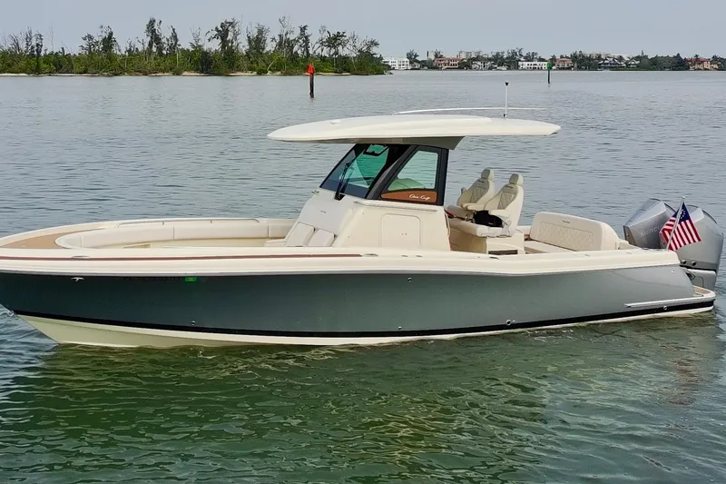 Slide: The Image of 2024 Chris-Craft Catalina 30 boat on calm water, featuring sleek design and modern amenities. - 1